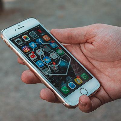 A persons hand holding a phone
